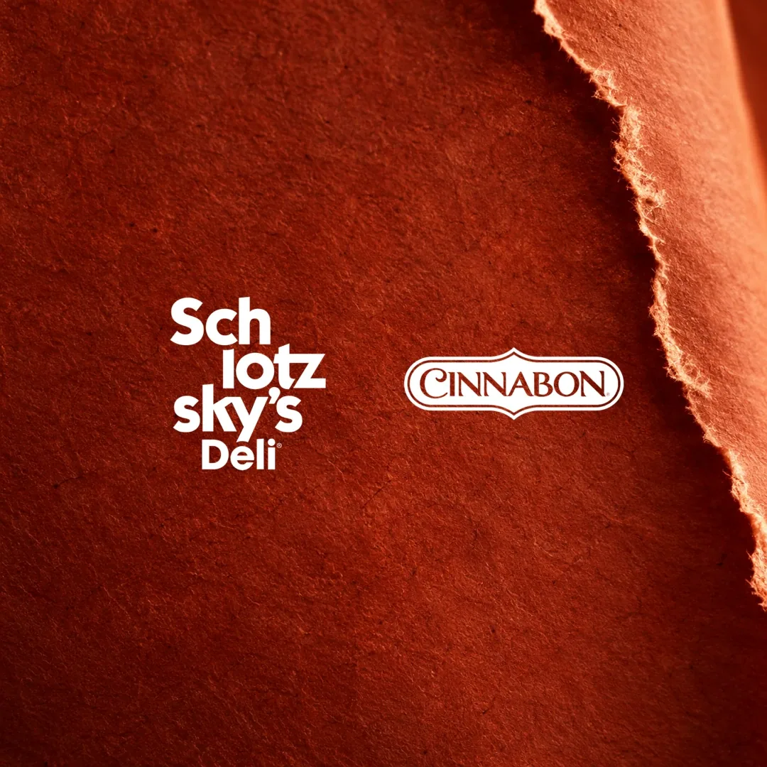 Schlotzsky’s and Cinnabon logos on a warm terracotta paper texture.
